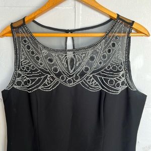 Black sleeveless evening dress perfect for black tie wedding.